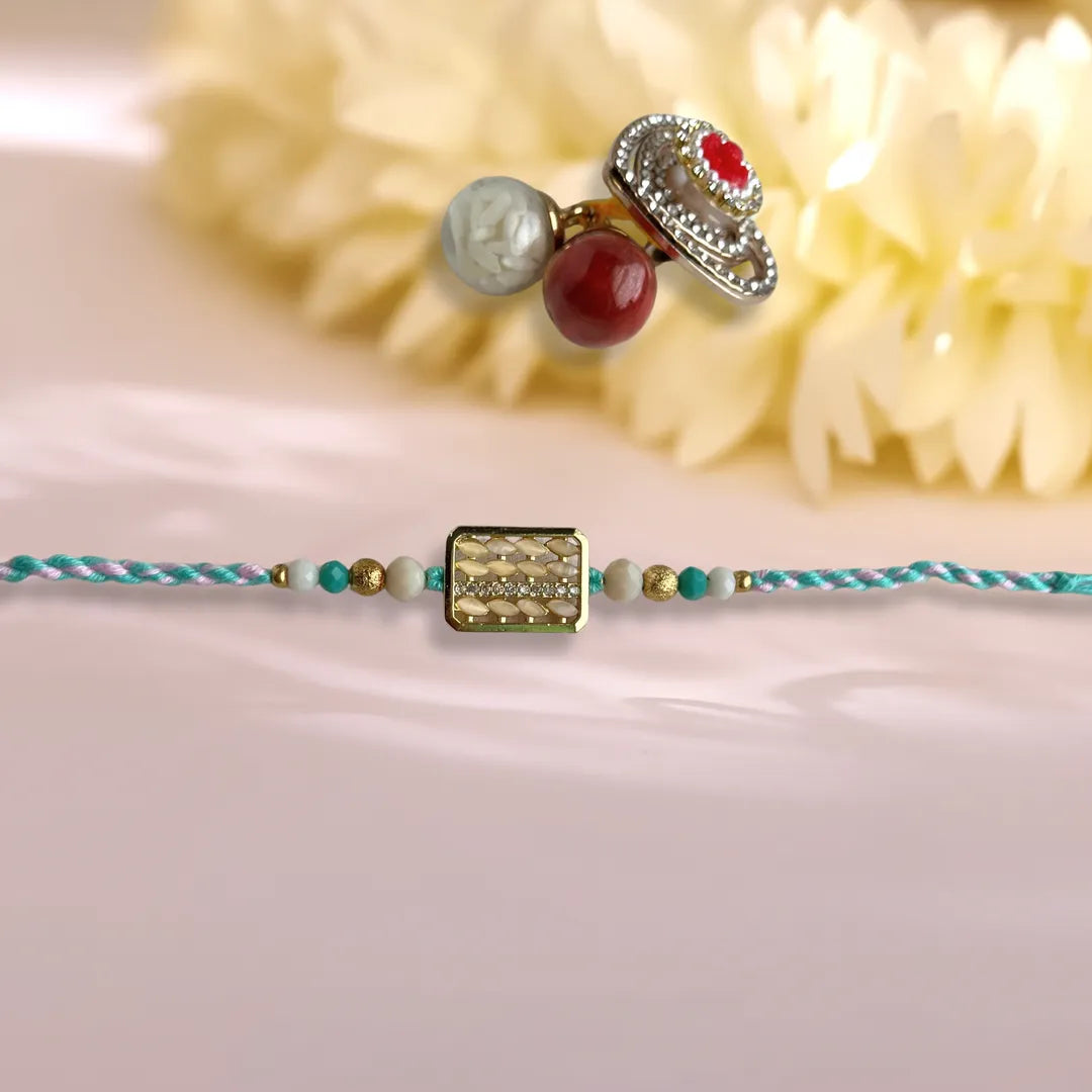 Rectangular Rice And American Diamond Pastel Thread Rakhi