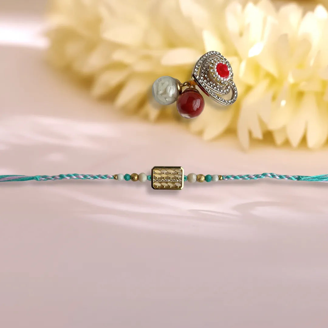 Rectangular Rice And American Diamond Pastel Thread Rakhi