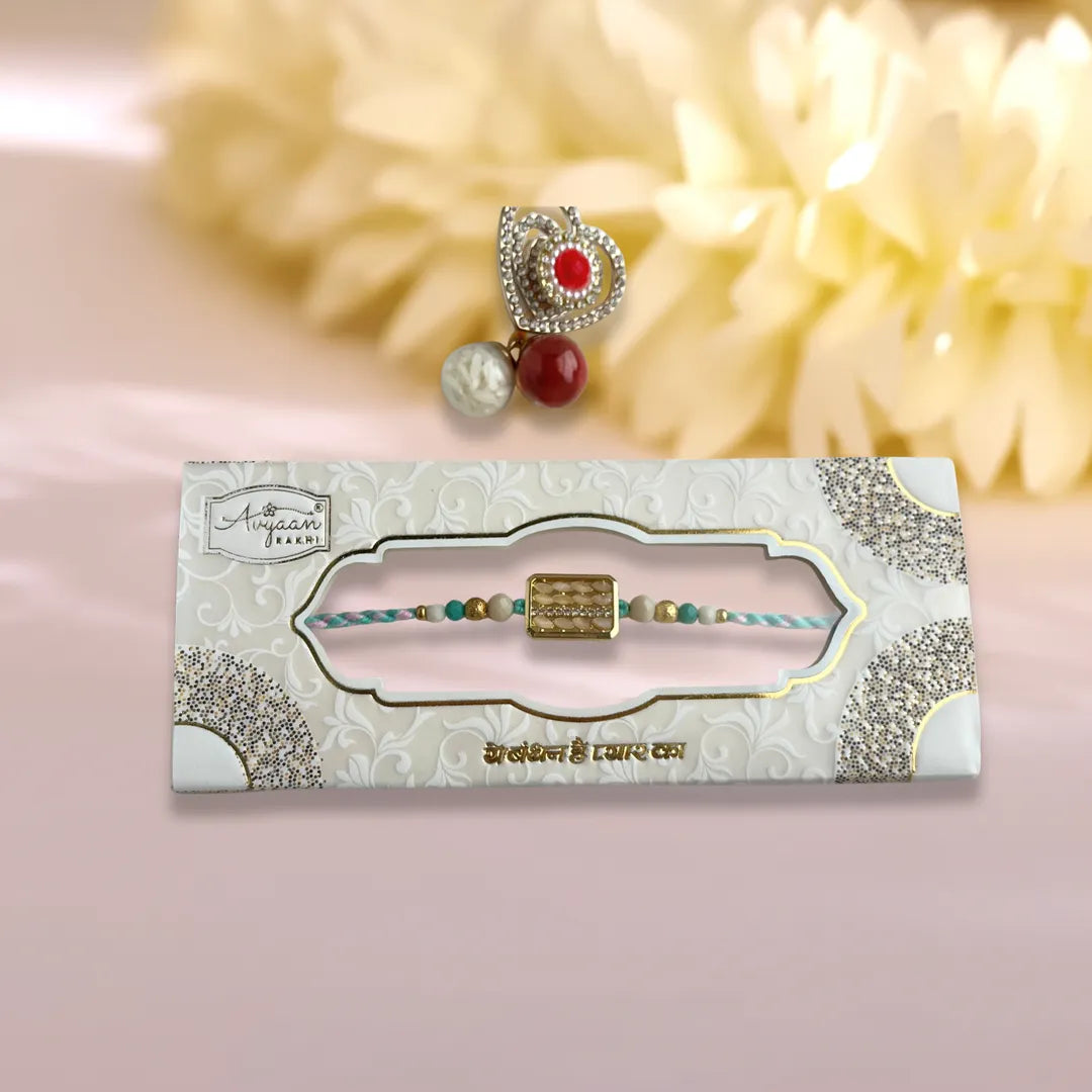 Rectangular Rice And American Diamond Pastel Thread Rakhi